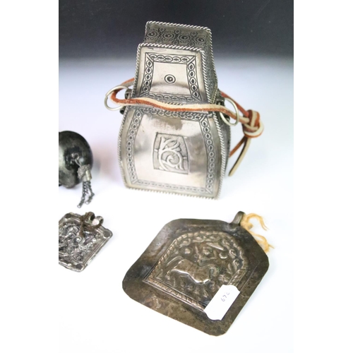 295A - A collection of mainly Indian white metal amulets including an example set with a large turquoise pa... 