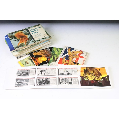 392 - Collection of assorted ephemera to include two partially filled world stamp albums, selection of tra... 