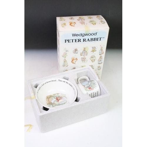 102 - Four Wedgwood Peter Rabbit mug and bowl boxed sets together with two boxed Peter Rabbit plates and o... 