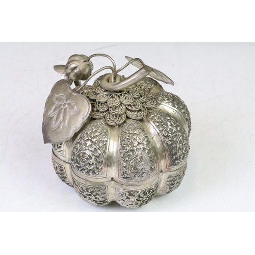 194 - A large Cambodian silver plated pumpkin shaped box of two pice construction, floral Repousse decorat... 