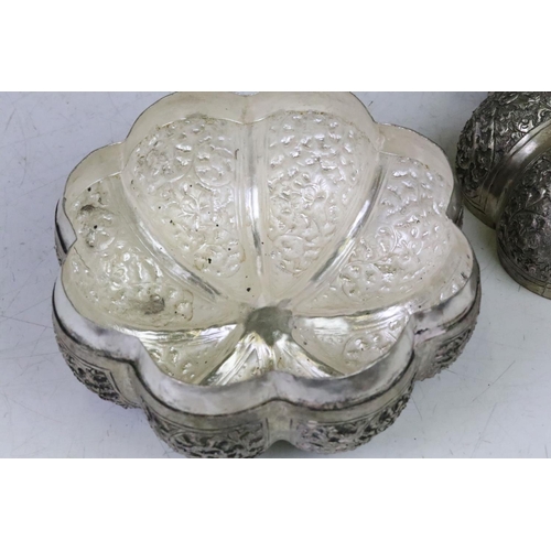 194 - A large Cambodian silver plated pumpkin shaped box of two pice construction, floral Repousse decorat... 