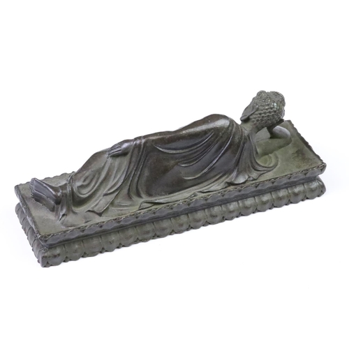 195 - A Chinese ornamental cast brass sleeping Buddha statue figure, measures approx 13.5cm in length x 5.... 