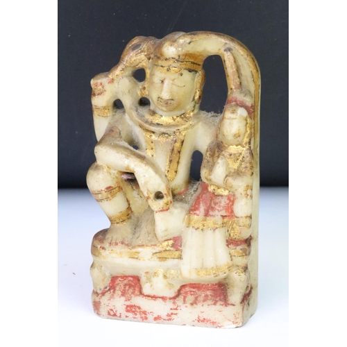 204 - A collection of four Indian carved stone hand painted figures, tallest approx 12.5cm