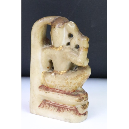 204 - A collection of four Indian carved stone hand painted figures, tallest approx 12.5cm