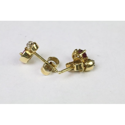 251 - Pair of yellow gold ruby and diamond stud earrings