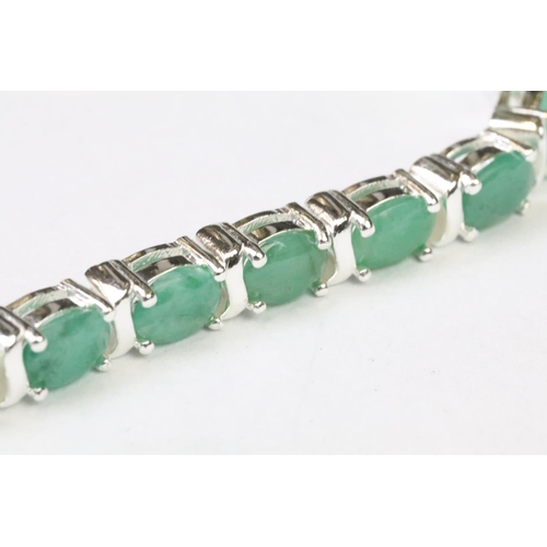 256 - Substantial silver and emerald line bracelet