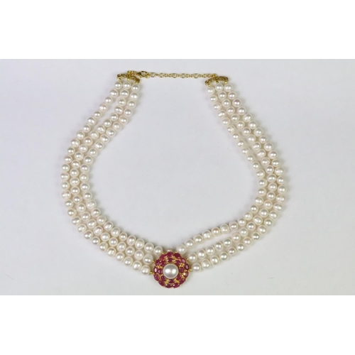 258 - Three row freshwater pearl necklace with ruby clasp