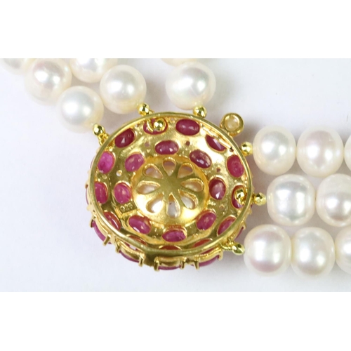 258 - Three row freshwater pearl necklace with ruby clasp