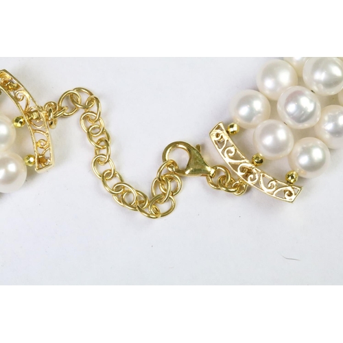 258 - Three row freshwater pearl necklace with ruby clasp