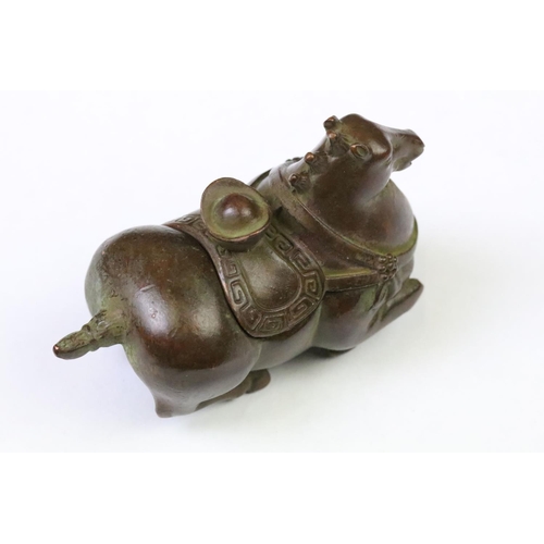 269 - A Chinese copper writing brush / pen washer statue in the form of a horse, removable lid, measures a... 