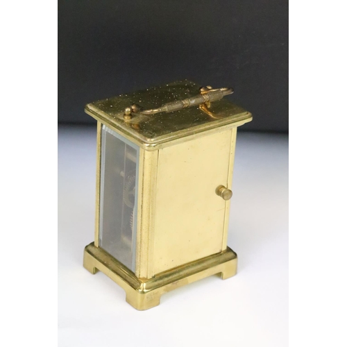 274 - A French Bayard brass cased carriage clock with beveled glass panels.