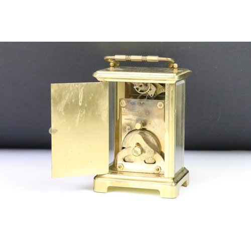 274 - A French Bayard brass cased carriage clock with beveled glass panels.