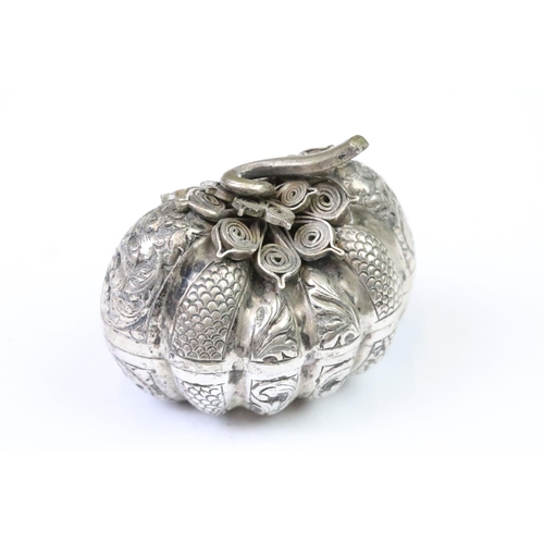 279 - A white metal (Tests Silver) Cambodian Pumpkin shaped betel nut holder, Repousse  decoration with fi... 