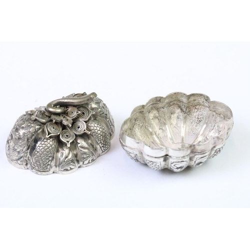 279 - A white metal (Tests Silver) Cambodian Pumpkin shaped betel nut holder, Repousse  decoration with fi... 