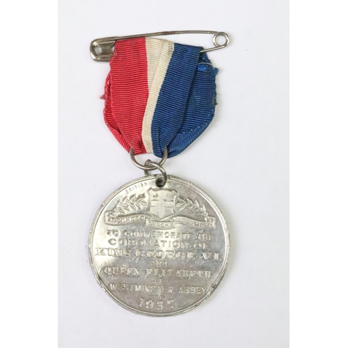 285 - A world war two era Police faithful service medal together with a quantity of coronation medals.