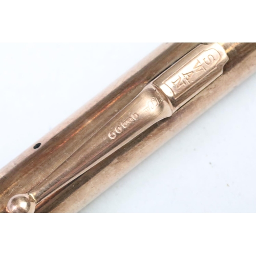 286 - A fully hallmarked 9ct rose gold fountain pen with 14ct gold nib, with inscription to side.