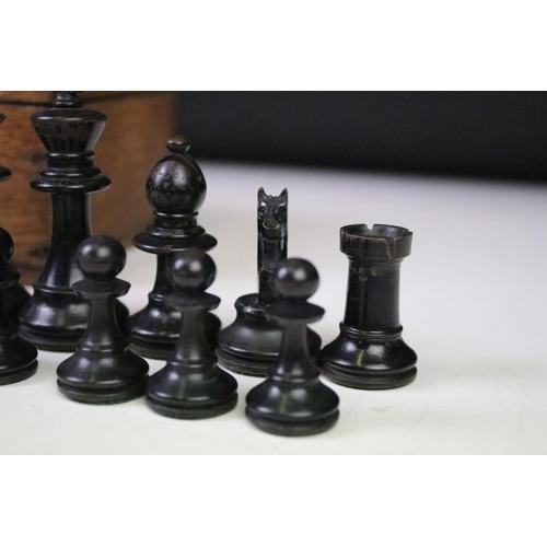 179 - A set of early 20th century boxwood chess pieces within wooden box.