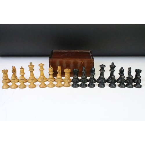 181 - A set of early 20th century boxwood chess pieces within wooden box.