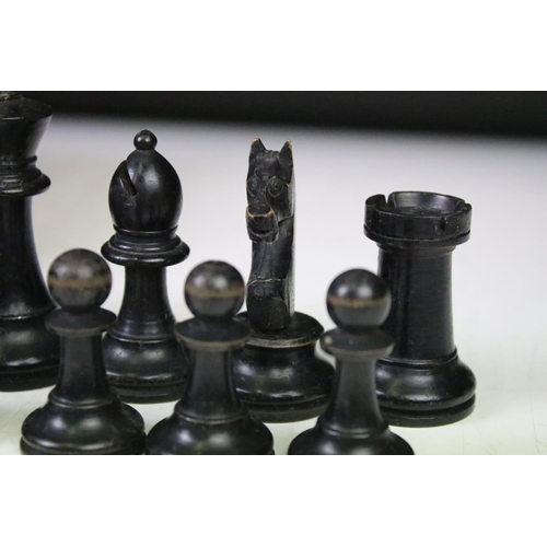 181 - A set of early 20th century boxwood chess pieces within wooden box.