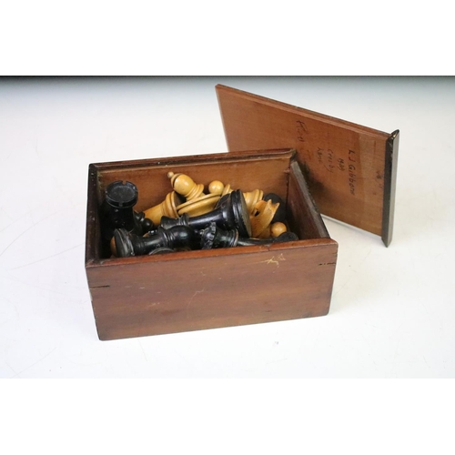 181 - A set of early 20th century boxwood chess pieces within wooden box.