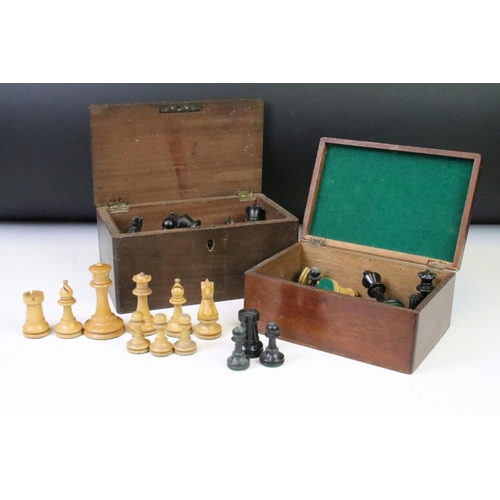 182 - A collection of mainly early 20th century boxwood chess pieces to include Jaques examples within two... 