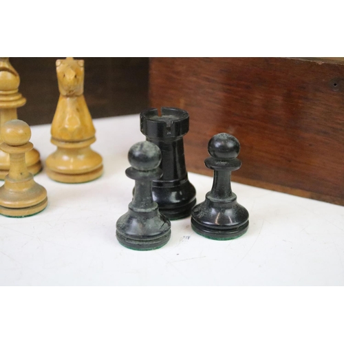 182 - A collection of mainly early 20th century boxwood chess pieces to include Jaques examples within two... 