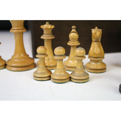 182 - A collection of mainly early 20th century boxwood chess pieces to include Jaques examples within two... 