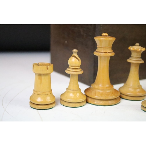 182 - A collection of mainly early 20th century boxwood chess pieces to include Jaques examples within two... 