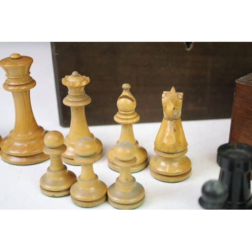 182 - A collection of mainly early 20th century boxwood chess pieces to include Jaques examples within two... 