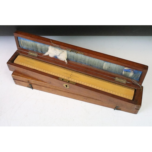 184 - A collection of early to mid 20th century boxwood rulers together with wooden storage boxes to inclu... 