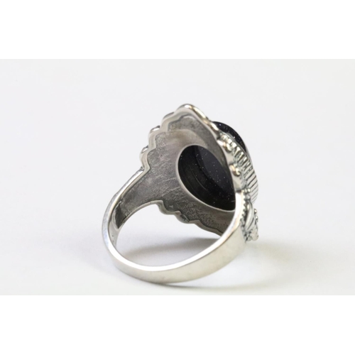 224 - A 925 Sterling silver with blue sandstone centre cabochon ladies ring with decorative surround, mark... 