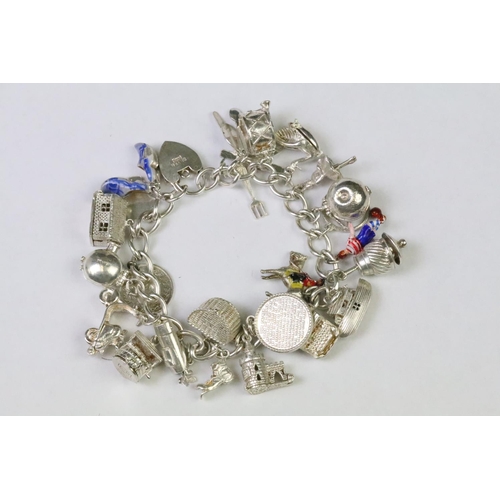 229 - A collection of sterling silver jewellery to include a charm bracelet complete with charms, silver n... 