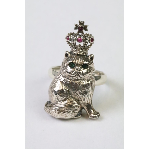 233 - Silver ring in the form of a cat wearing a jewelled crown