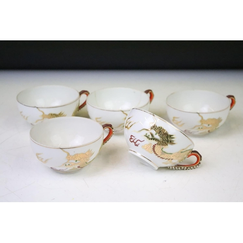 90 - Mid Century Japanese tea set having a white ground with gilt and enamelled dragon detailing, compris... 