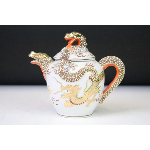 90 - Mid Century Japanese tea set having a white ground with gilt and enamelled dragon detailing, compris... 