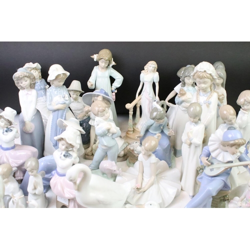 92 - Extensive collection of Spanish Nao figurines to include single figures and groups, as well as swan ... 