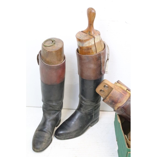 374 - A group of three pairs of vintage leather riding boots complete with wooden trees.