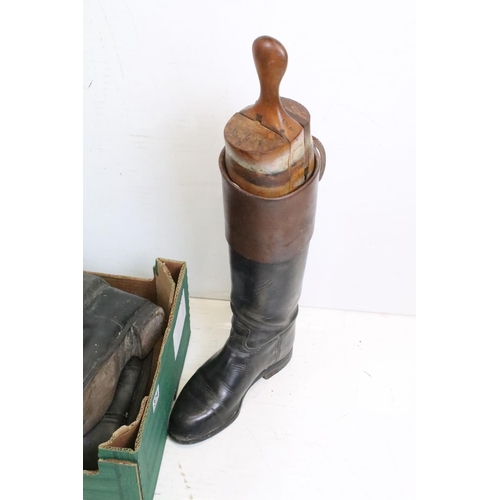 374 - A group of three pairs of vintage leather riding boots complete with wooden trees.