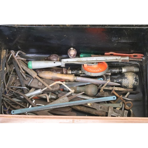 387 - A vintage metal tool box complete with mixed tools to include vices, wrenches....etc.