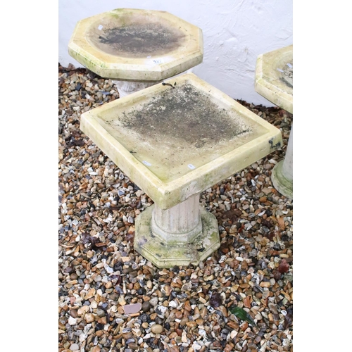 527 - Group of three contemporary reconstituted stone bird baths on Corinthian column bases, two of hexago... 