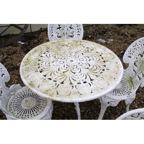 531 - White painted cast metal patio table with four matching chairs, table approx 65cm high