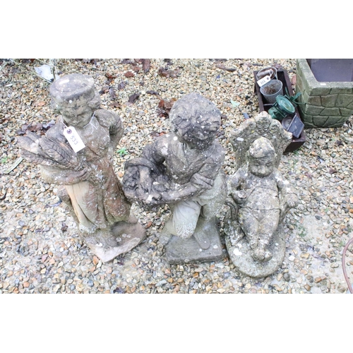 533 - Collection of three reconstituted stone ornamental garden figures, to include a seated gnome, talles... 