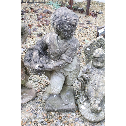 533 - Collection of three reconstituted stone ornamental garden figures, to include a seated gnome, talles... 