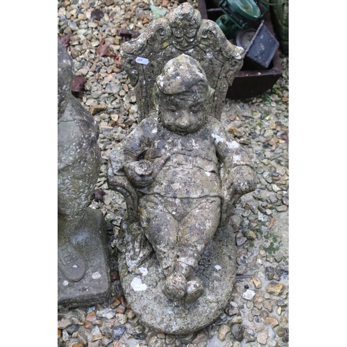 533 - Collection of three reconstituted stone ornamental garden figures, to include a seated gnome, talles... 