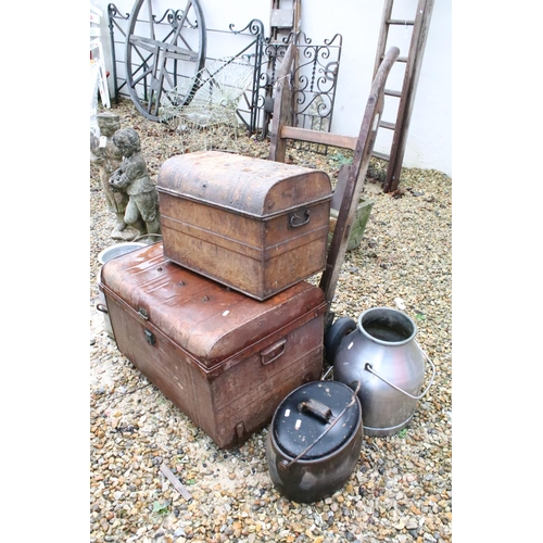 534 - Two metal trunks, together with two churns, a cast iron pot and a Slingsby wooden sack truck