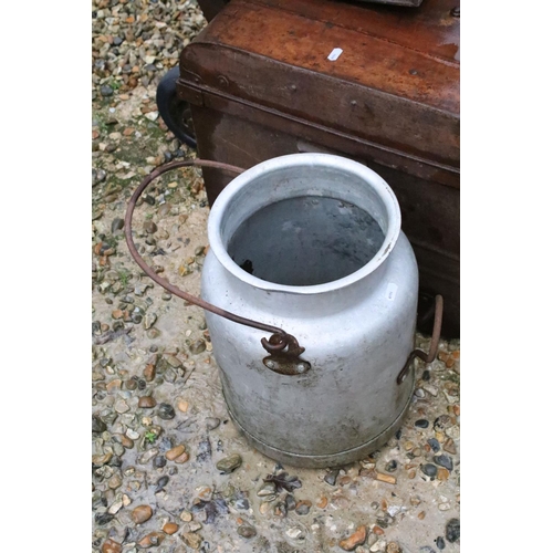 534 - Two metal trunks, together with two churns, a cast iron pot and a Slingsby wooden sack truck