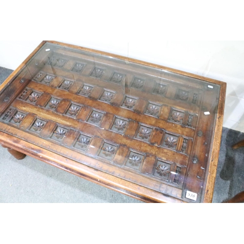 538 - Indian Hardwood Coffee Table, the top formed from an antique decorative door with carved flowers set... 