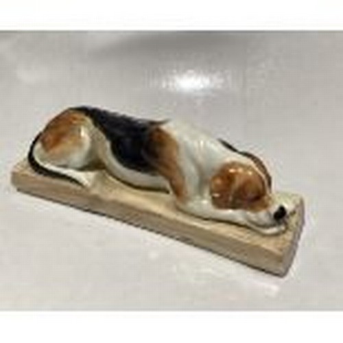 13 - Royal Worcester model of a Hound Dog modelled by Doris Lindner no. 2998, puce marks to base, 12.5cm ... 