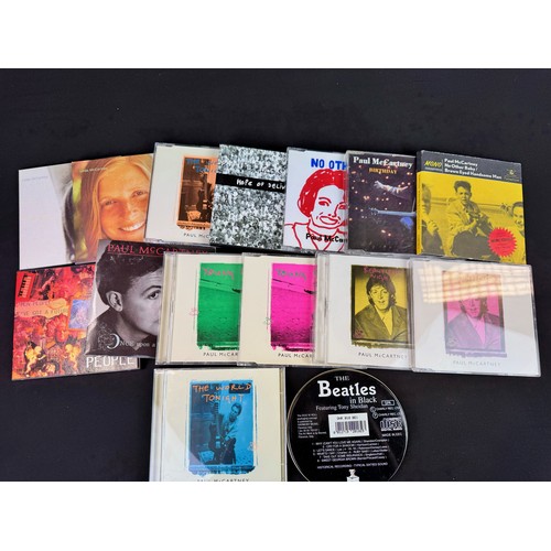 894 - CDs / Music Memorabilia - Collection of various The Beatles related items to include a selection of ... 