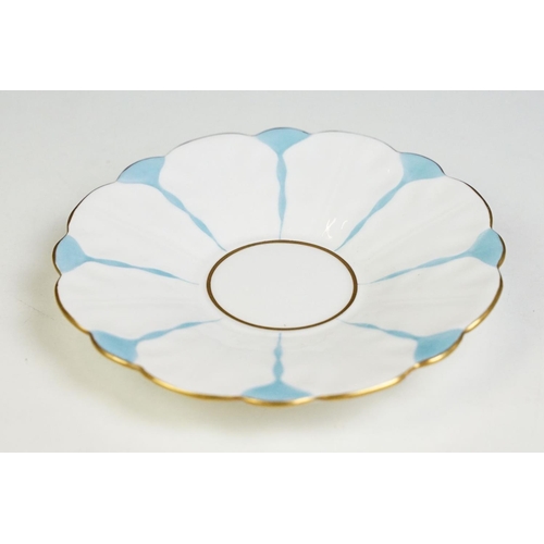 74 - Aynsley Art Deco tea cup and saucer having a butterfly formed handle, gilt rims and blue hand painte... 